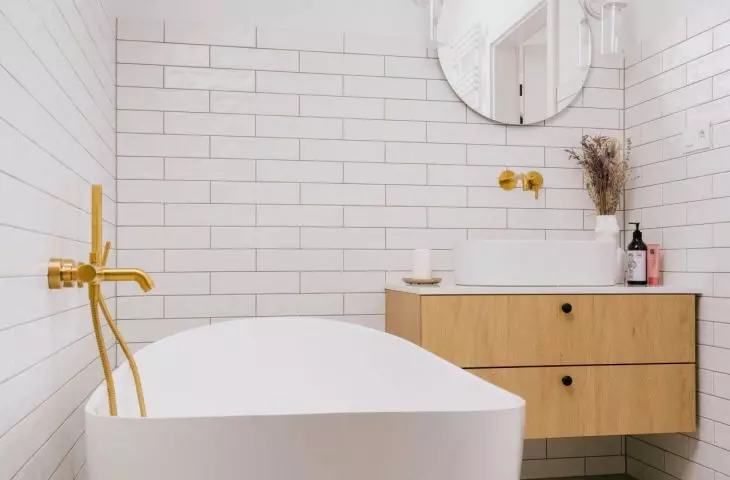 Combination of subway tiles with terazzo motif adds variety to the space