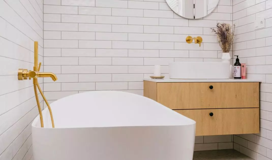 Combination of subway tiles with terazzo motif adds variety to the space
