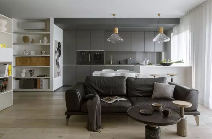 The apartment is dominated by a subdued color scheme