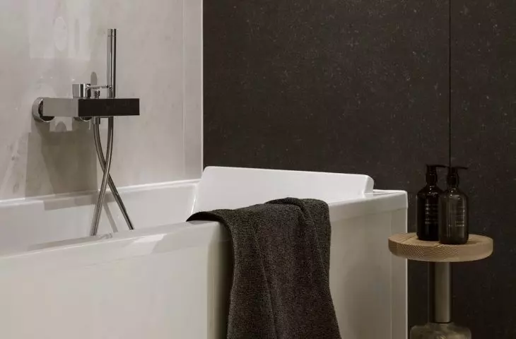 Stool with wooden seat and stone base makes an interesting addition