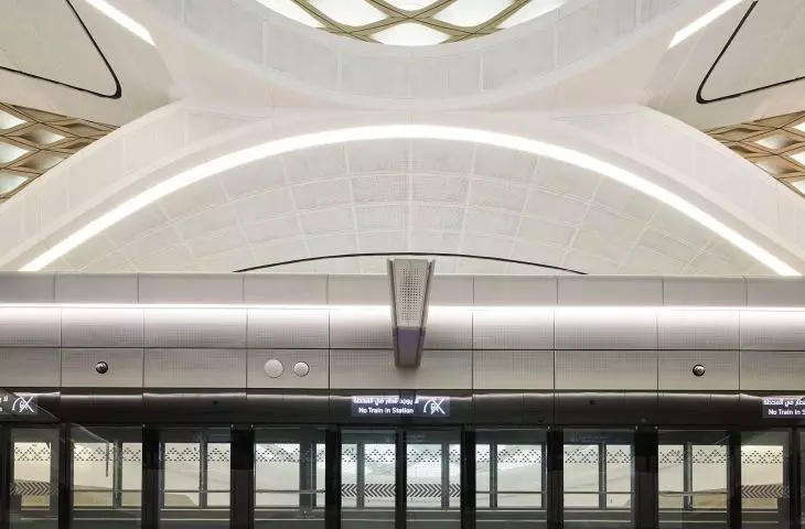 King Abdullah Financial District (KAFD) metro station in Riyadh - the interior space is enhanced by white concrete panels, patterned floors and gold-tone details
