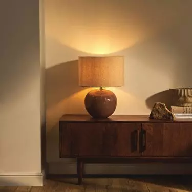 Lamp with brown lampshade will bring warm light into the interior