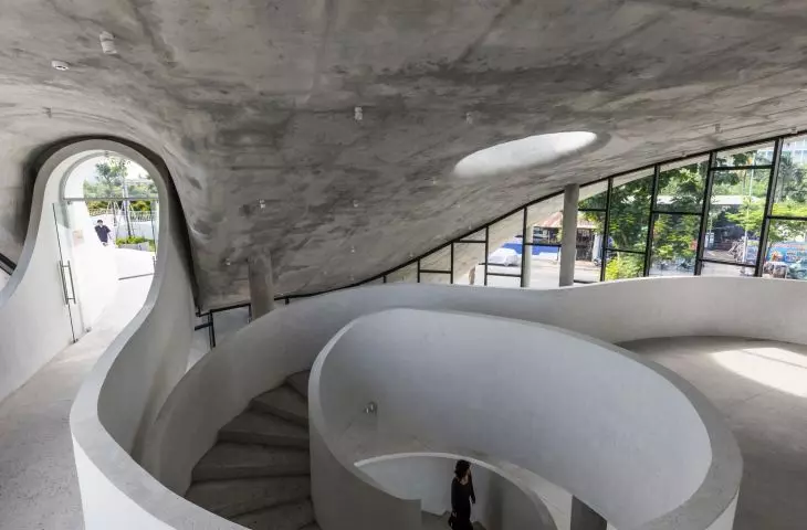 Art Exhibition Center in Son Tra, Vietnam - a spiral staircase connecting two levels 