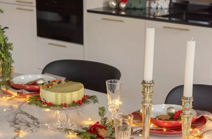 Christmas decorations stand out on marble countertop