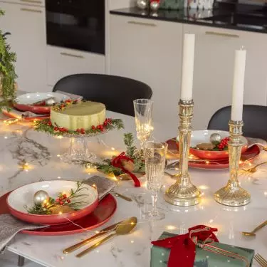 Christmas decorations stand out on marble countertop