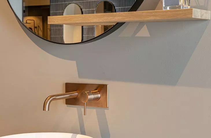 Concealed towel rack and faucet in brushed copper PVD