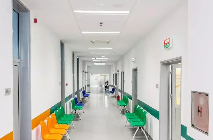 Highly reflective white hygienic ceiling helps illuminate windowless corridors