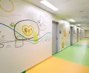 New hospitals are increasingly willing to move away from classic white, also introducing color accents or decorations to the interiors as on the walls of the Children's Clinical Hospital WUM in Warsaw 