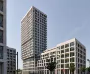 Scheldehof residential complex in Nieuw Zuid, Antwerp - one of the buildings has a rectangular plan and a tower, while the other takes on an L-shape