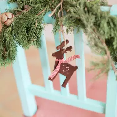 Decorating the chairs will add variety to the Christmas arrangement