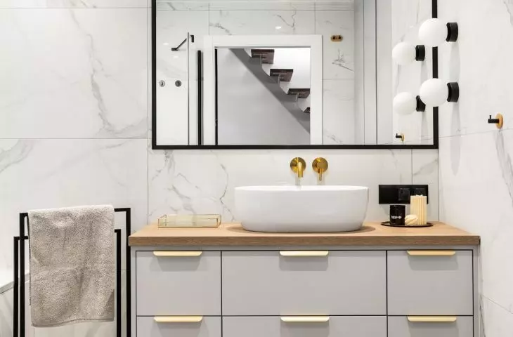 The bathroom is kept in subdued colors