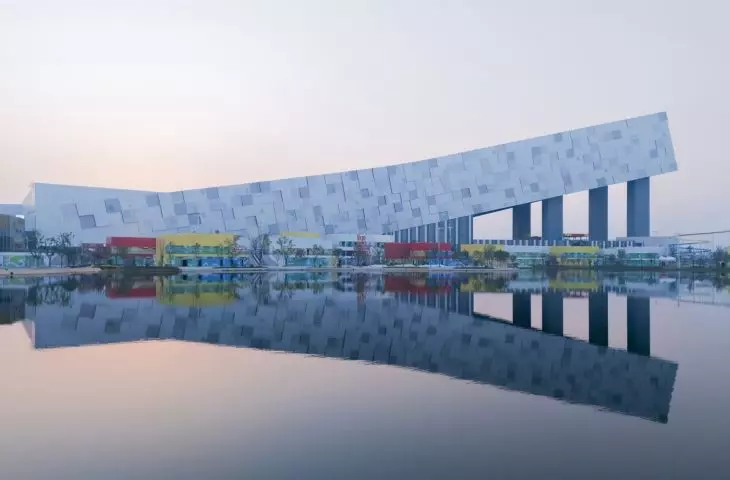 Wuhan ski resort - the facade of the building housing the slope consists of cascading, interactive modules resembling pixels