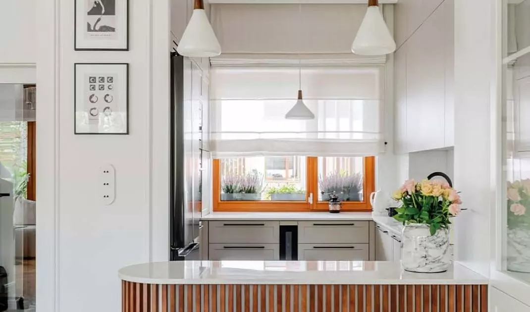 The wall in the kitchen area is decorated with graphics collected by the investor