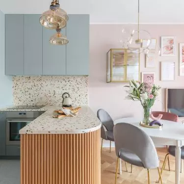 Terrazzo covers both the countertop and the wall above it 