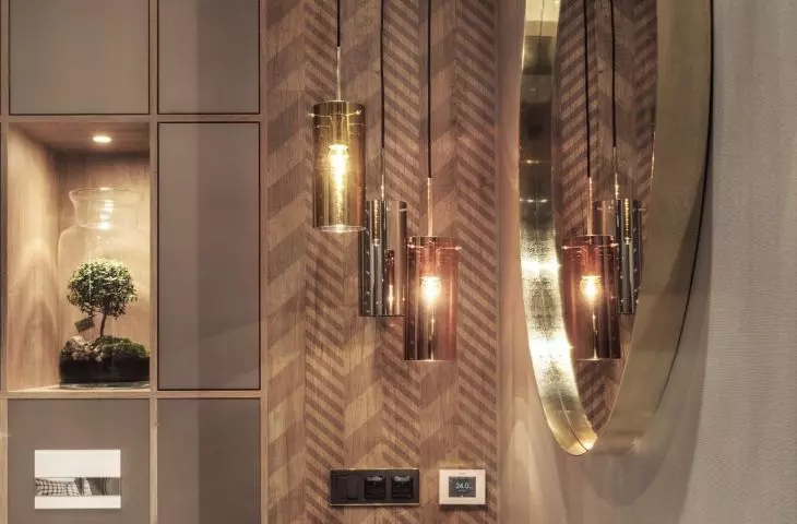 The wall next to the mirror was decorated with a chevron pattern