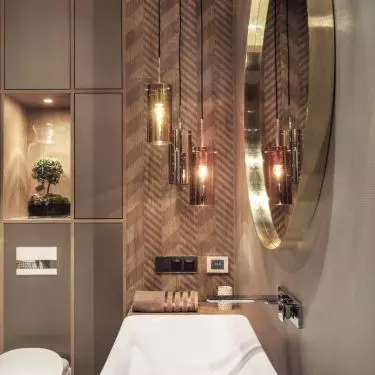 The wall next to the mirror was decorated with a chevron pattern