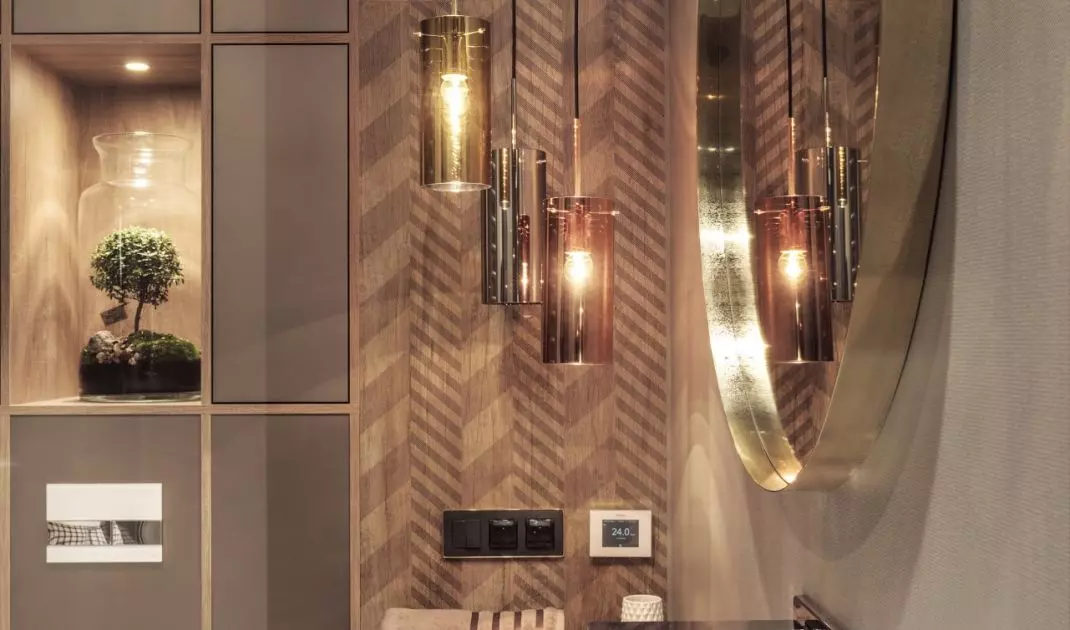 The wall next to the mirror was decorated with a chevron pattern