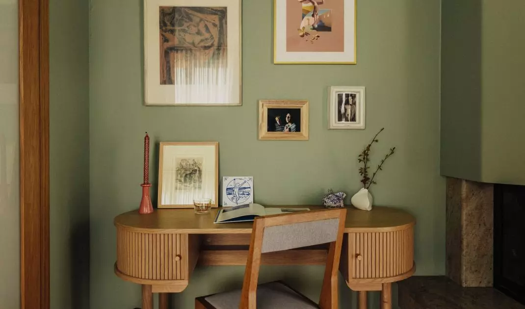 The workspace was decorated with a gallery of graphics and paintings