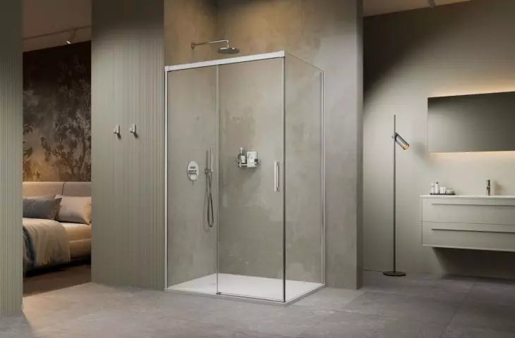 In a small bathroom, a shower stall with sliding doors will work better