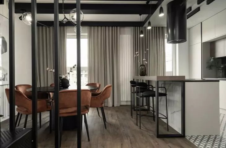The dining room and kitchen are right next to the staircase