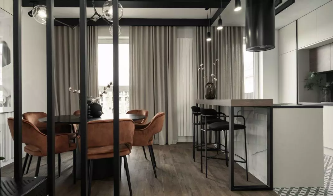 The dining room and kitchen are right next to the staircase