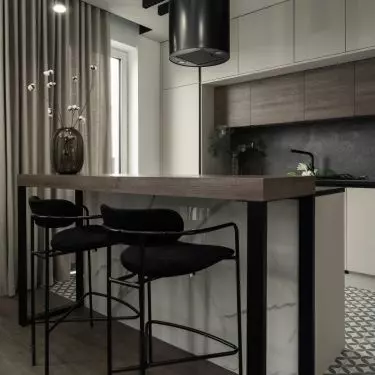 The kitchen island was equipped with black hockers