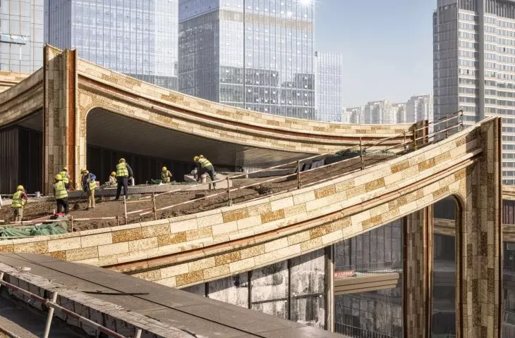 Cultural and Business Center in Xi'an, China - the roofs of the commercial podium, with a stepped structure, reaching nearly 24 meters, create the impression of an integrated whole that connects to terraces, gardens and plazas