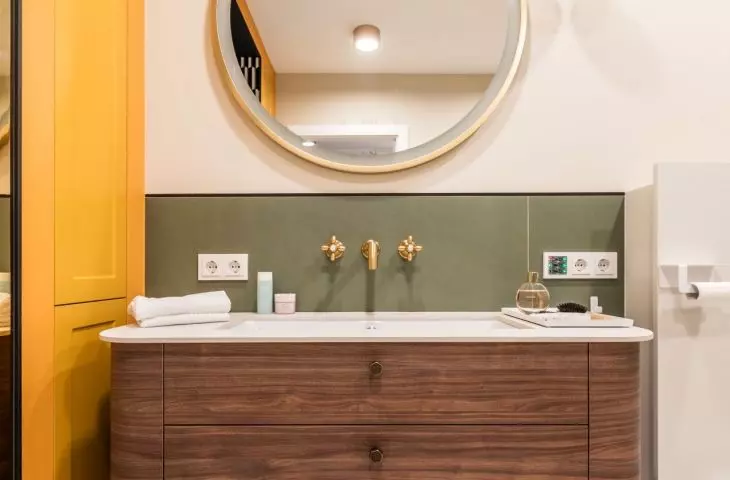 The wooden cabinet has a rounded form