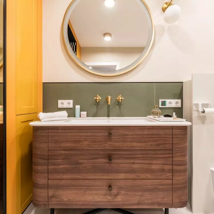The wooden cabinet has a rounded form