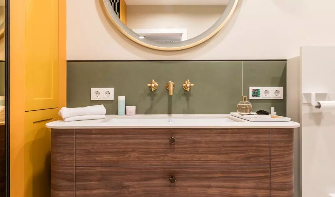 The wooden cabinet has a rounded form