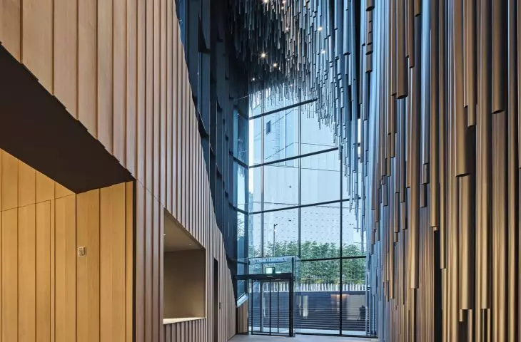 Audeum, or the Sound Museum in the Gangnam-gu district (Seoul, South Korea) - the building's interior seamlessly transitions from raw aluminum surfaces on the exterior to more organic wooden finishes