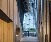 Audeum, or the Sound Museum in the Gangnam-gu district (Seoul, South Korea) - the building's interior seamlessly transitions from raw aluminum surfaces on the exterior to more organic wooden finishes