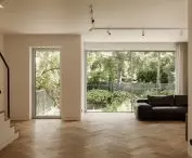 Conversion of a 1970s semi-detached house.