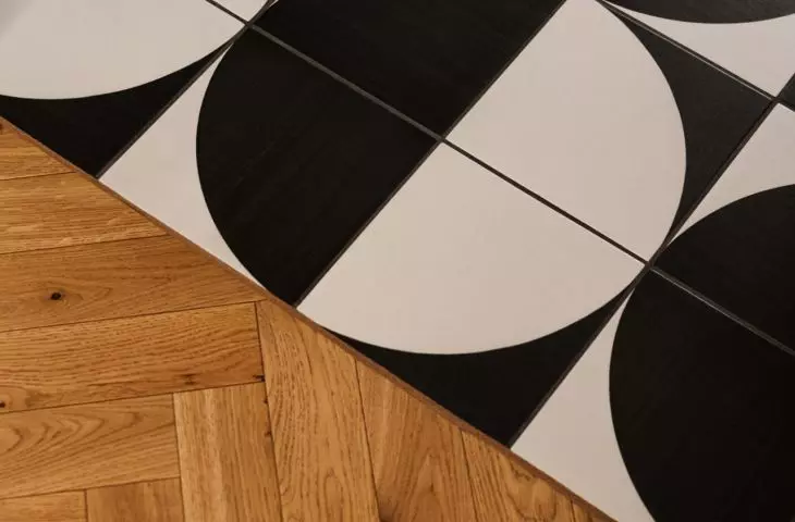 Black and white floor with graphic pattern enlivens the arrangement