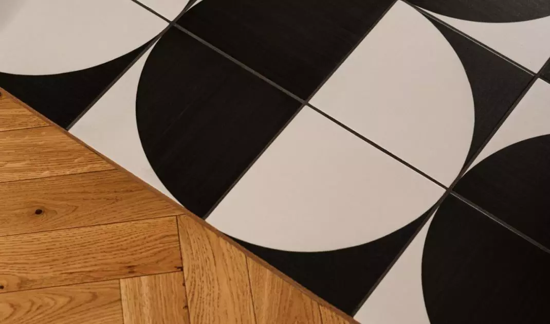 Black and white floor with graphic pattern enlivens the arrangement