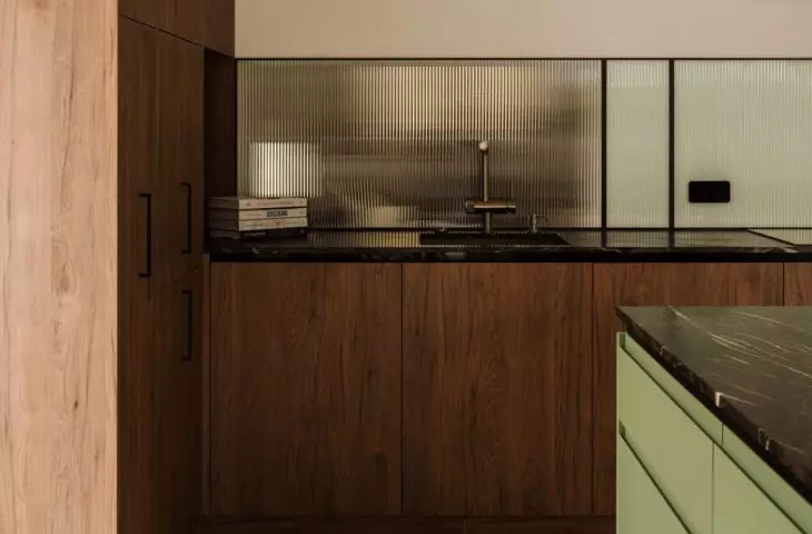 Dark wood warms up kitchen design