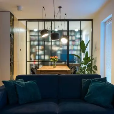 The heart of the living room is the navy blue couch