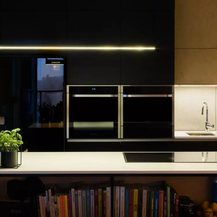 Black cabinet fronts were juxtaposed with natural wood 