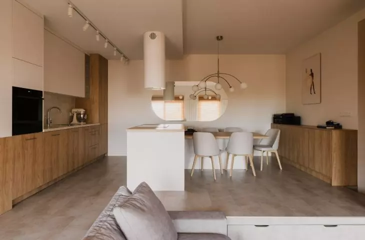 The floor in the kitchen and dining area of the apartment has been raised