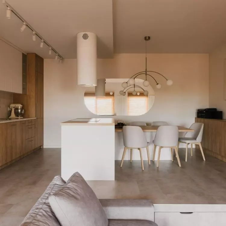 The floor in the kitchen and dining area of the apartment has been raised
