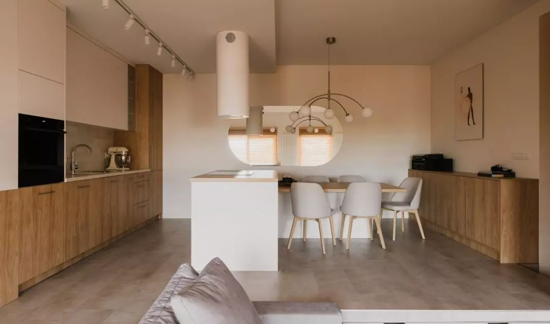 The floor in the kitchen and dining area of the apartment has been raised