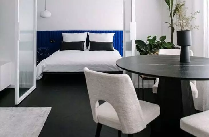 walls of ornamental glass separate the different parts of the apartment
