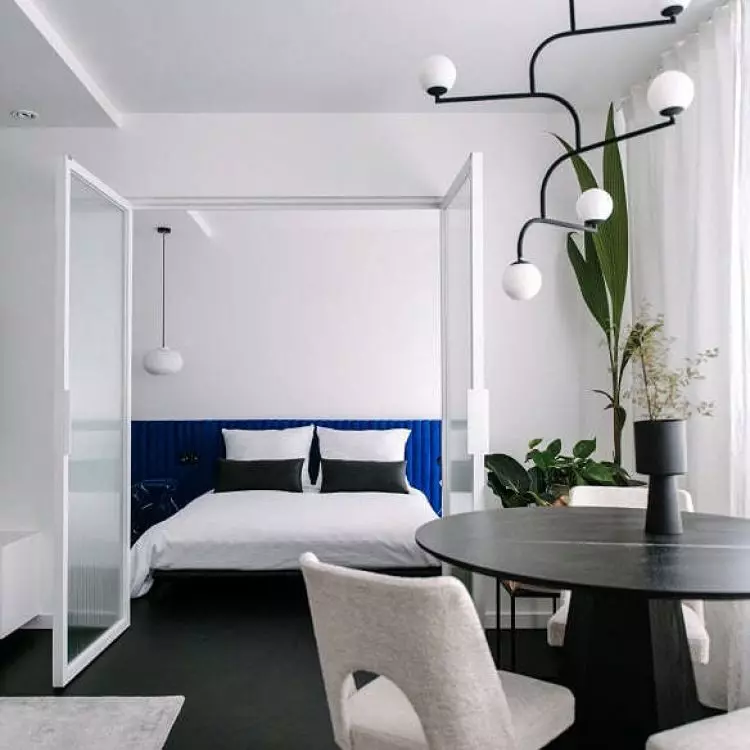 walls of ornamental glass separate the different parts of the apartment