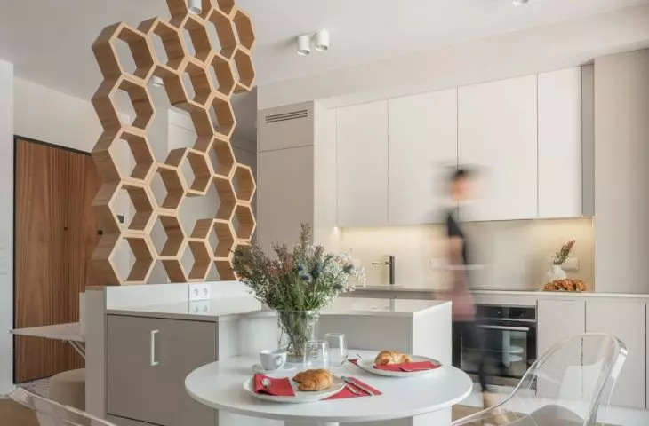 Hexagonal wall separates workspace from kitchen