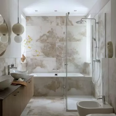 The bathroom is kept in a beige color scheme