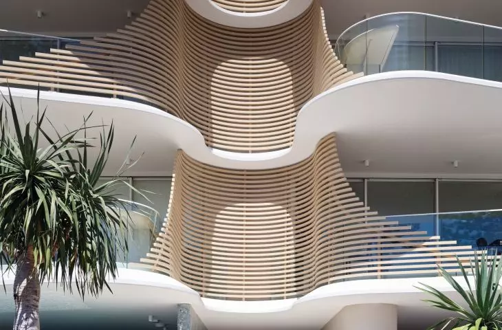 Norfolk residential building in Gold Coast, Queensland, Australia - the centerpiece of the facade is horizontal laths with gentle curves, acting as a sunshade in the warmer months