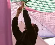 industrial warehouse racks, tarpaulins and nets used for scaffolding were used to build 