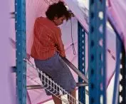 industrial warehouse racks, tarpaulins and nets used for scaffolding were used to build 