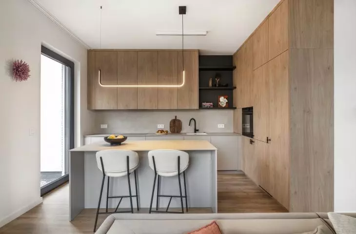 The kitchen cabinet has two different front finishes