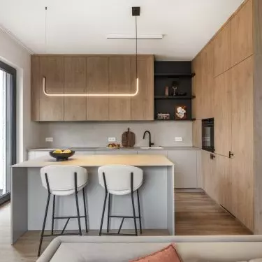 The kitchen cabinet has two different front finishes